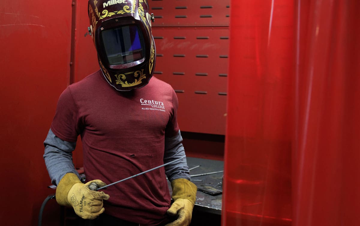 Centura combination welding student wearing welding gear